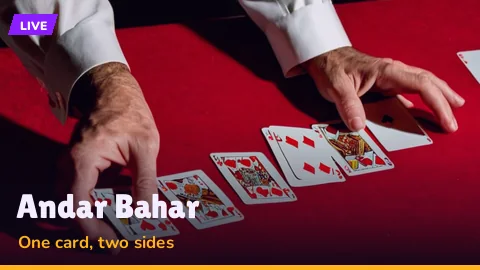 Face-up joker in the middle of an Andar Bahar layout with chips stacked on both sides